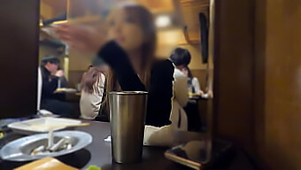 Japanese Hostess And Patrons Engage In Private Room Activities At A Bar