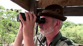 An Elderly Man Engages In Sexual Activity With A Young Woman While Out Hunting